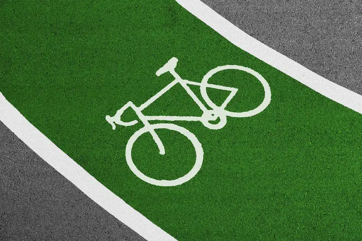 Protected bike lane in busy urban neighborhood with cyclists