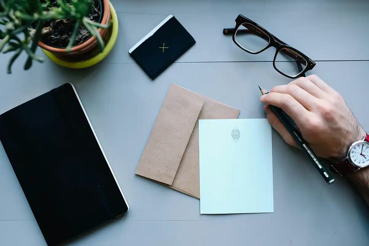 Printed AI policy documents and notes on a daylight office table