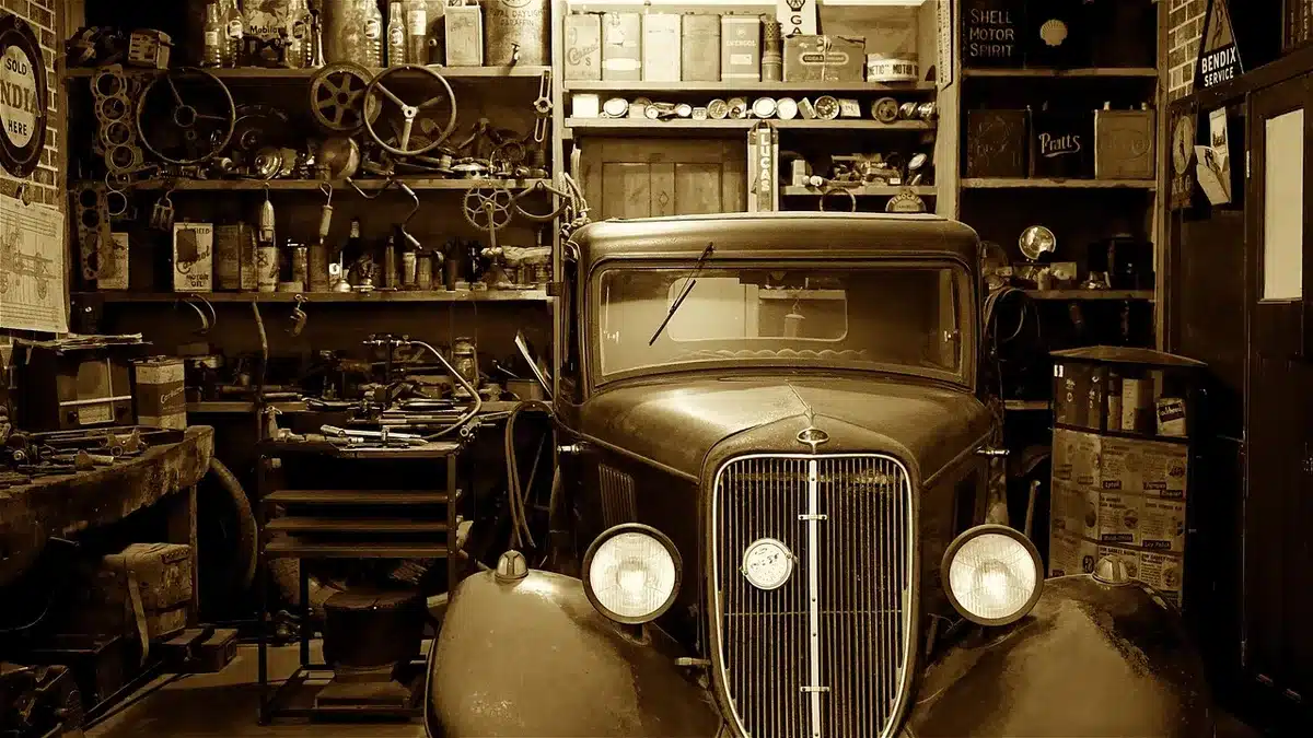 Tools and parts laid out on a garage bench for car maintenance