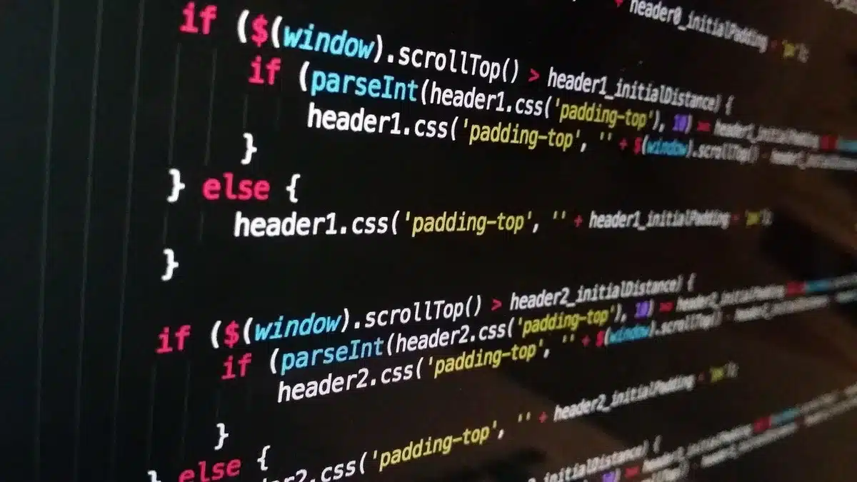 Engineer checking sitemap and monitoring tools on a laptop near a window
