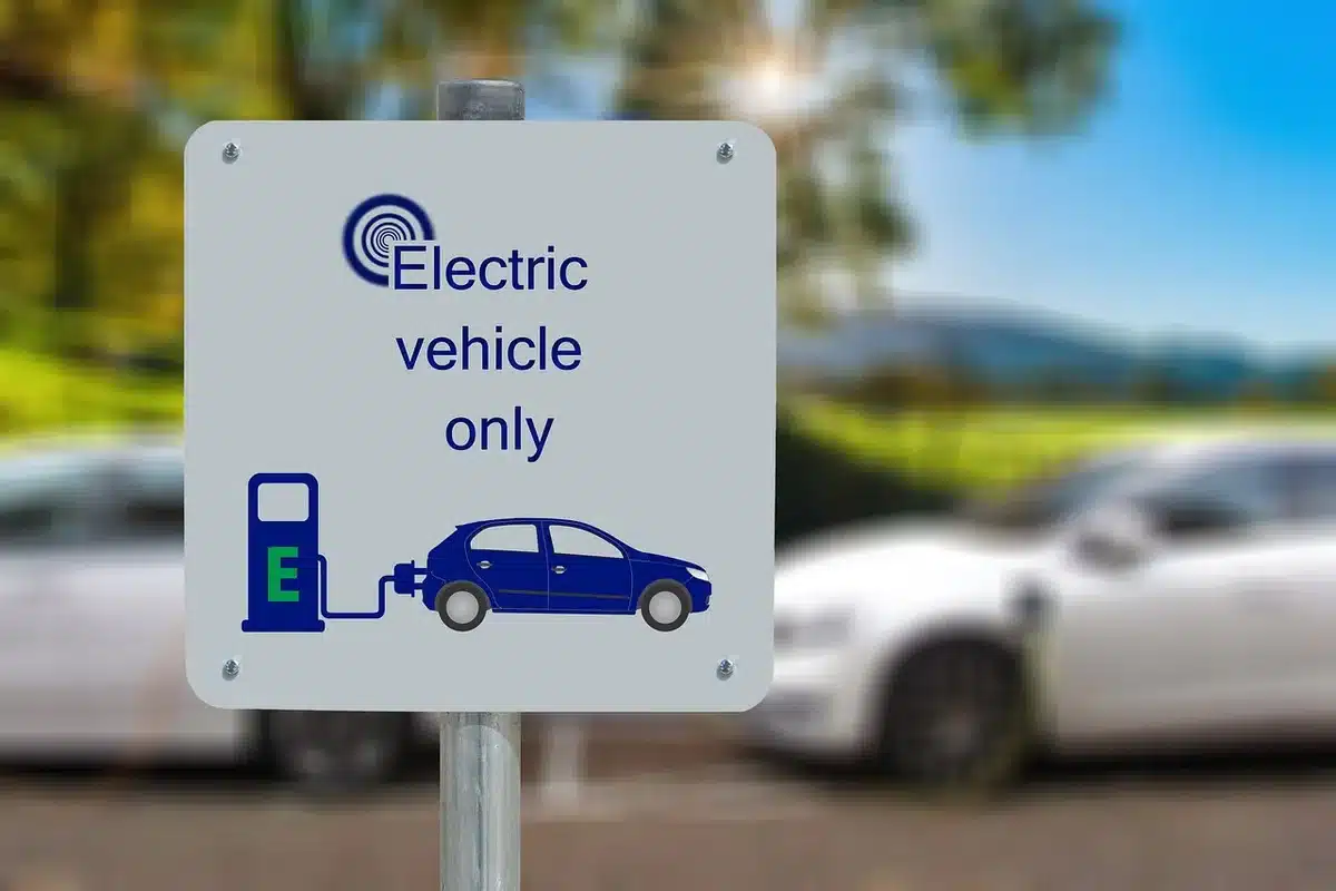 Technicians in a bright workshop learning to service electric vehicles