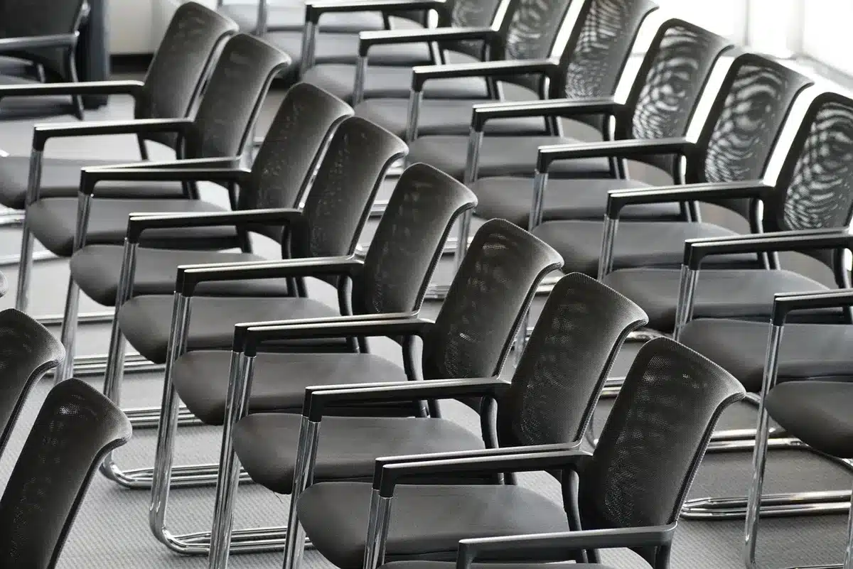 Rows of international delegates at a conference table discussing pact signings